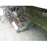 A vintage Atco petrol driven cylinder lawn mower complete with aluminium grass collection box,