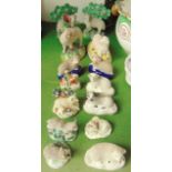 A collection of 19th century Staffordshire and other models of sheep and rams including a pair of