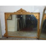 A 19th century gilt framed over mantel mirror of rectangular form with trailing floral moulded