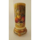 A Royal Worcester ivory ground vase of cylindrical form raised on a circular pierced gilded base