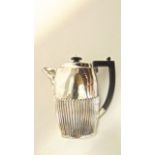 An Edwardian silver hot water pot, probably John Millward Banks, Chester, 1905, the oval body with