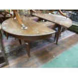 An extending Victorian mahogany D-end dining table raised on four square tapered legs, 130cm wide (