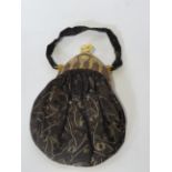 A 1920s lady's evening bag, in the Egyptian manner, with moulded plastic clasp, with impressed