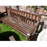 A stained hardwood 3-seat garden bench with slatted seat and back, 6ft long approximately