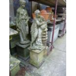 A weathered cast composition stone garden ornament in the form of a classical female water