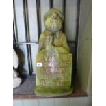 A weathered cast composition stone garden ornament in the form of a country gent with plaque "