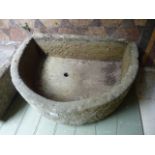 A D-end stone trough 65cm long x 49cm wide x 21cm deep approximately