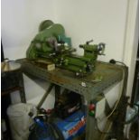 A Myford ML10 engineer's lathe, together with various associated parts and attachments, mounted on a