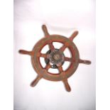 A 20th century miniature six pointed timber ships wheel with metal mounts, 47 cm diameter