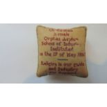 An early 19th century pin cushion with sampler work detail, Cheltenham Female Orphan Asylum School