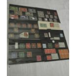 A folder of British mint and used stamps and further cards, a copy of a Penny Black re-issue limited