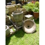 Four weathered cast composition stone garden planters in the form of coopered half barrels, together