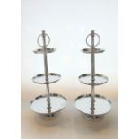 A pair of contemporary chromium plated 3-tier cake stands of graduated circular form raised on