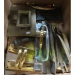 A collection of various brass door plates, a brass lock plate with knocker, cast iron letter