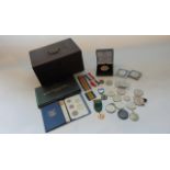 An oak box containing mixed English coinage including crowns, etc, mainly mid to late 20th century