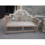 A Lutyens style teakwood garden seat (with Indonesian legal wood tag), 170cm long - the purchaser to