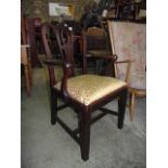 A Georgian mahogany open elbow chair with central pierced slat over shaped arms, drop in upholstered