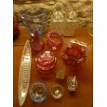 A selection of cranberry glass wares to include a basket with pinched rim and shaped clear glass
