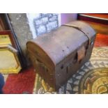 A vintage brown fibre and leather reinforced domed top travelling trunk with applied diamond