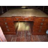 A good quality walnut veneered shallow inverted breakfront twin pedestal partners writing desk