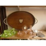 A substantial drinks tray of oval form, principally in oak, with pierced silver plated gallery sides