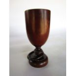 A good quality turned fruit wood goblet with bladed knopped stem crafted with a puzzle ring to