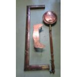 An Arts & Crafts style copper clad fire curb, a further Arts & Crafts style trivet, with hammered