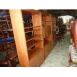 Three 1970s teak room dividers, each module 198 cm tall x 98 cm wide, each of a different but