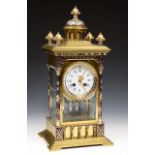 A good quality 19th century brass and enamelled four pane mantel clock, the case work with turned