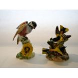 A Beswick model of a Chickadee with impressed number to base 929 and a Beswick group of a pair of