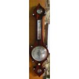 A mid-19th century rosewood wheel barometer with silvered dials, the case work with mother of