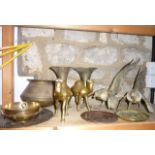 A collection of decorative brasswares to include a large pair of pheasant figures, a pair of camels,