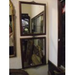 A pair of wall mirrors of rectangular form with moulded frames and tied ribbon mounts, 60 x 47 cm