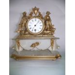 A Victorian gilt spelter and alabaster mantel clock in the classical style enclosing an enamelled