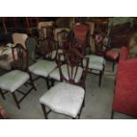 A set of six (four plus two) reproduction Hepplewhite style dining chairs, the moulded frames with