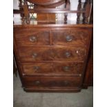 A Victorian mahogany bedroom chest of three long and two short drawers, flanked by rounded corners