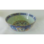 A 19th century Imari type punch bowl with painted gilded floral decoration to the exterior and