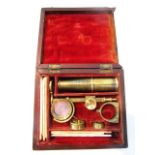 A miniature 19th century cased miniature travelling microscope (deconstructed) together with a small