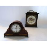 A small Edwardian mantel clock, the mahogany case with inlay detail enclosing an eight day timepiece