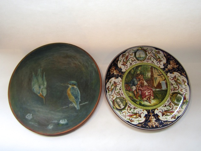 A late 19th century Torquay Longpark terracotta charger with painted kingfisher decoration and