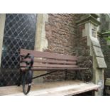 A sprung steel garden bench with wooden slatted seat and back rail, 6ft long approximately