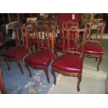 A set of seven 19th century walnut framed dining chairs with shaped, carved and moulded frames,