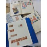 Two loose leaf files containing a number of Penny Red stamps as well as collections of British and