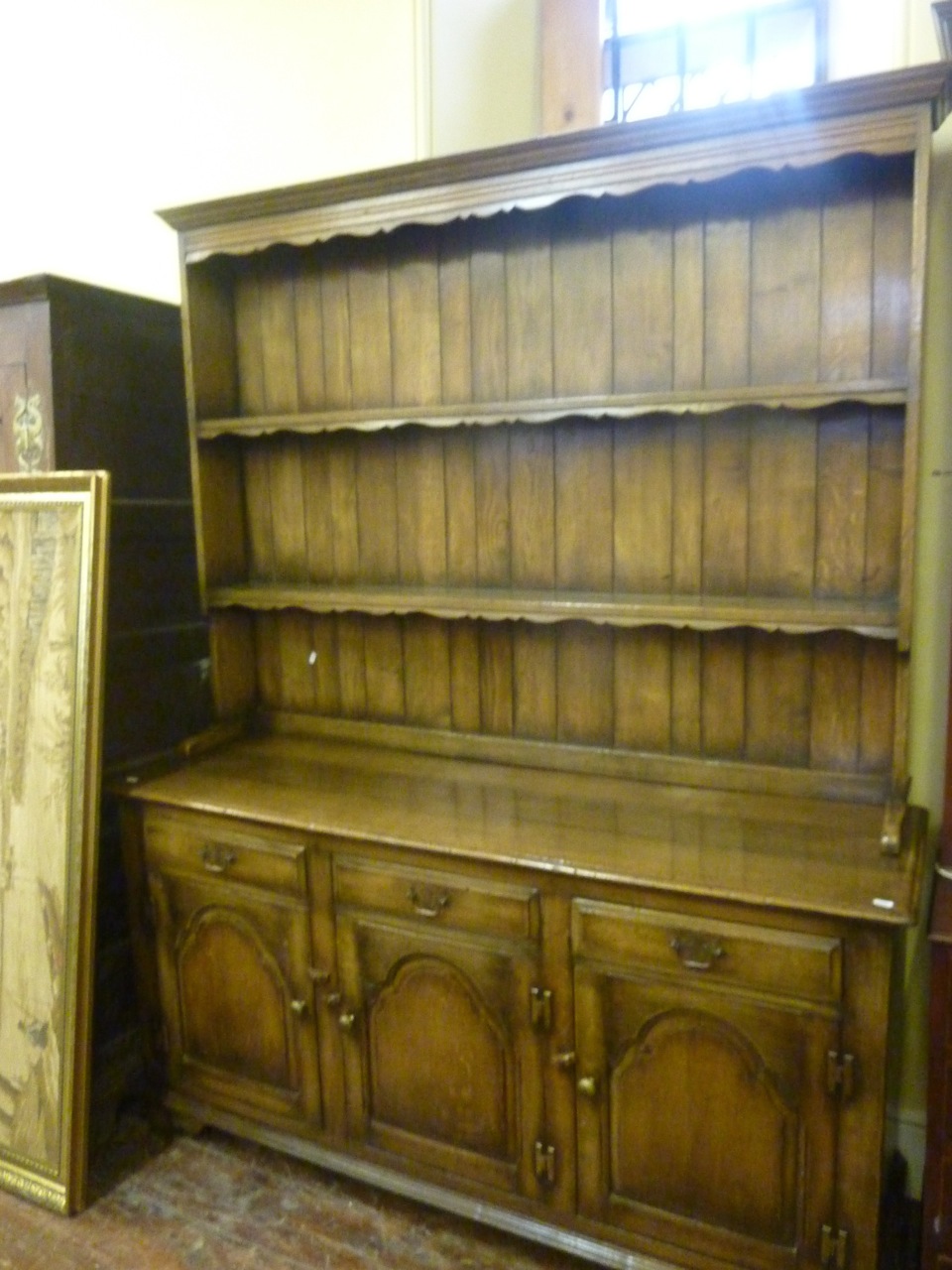 A good quality reproduction oak refectory table in the old English style, by Titchmarsh and Goodwin, - Image 4 of 6