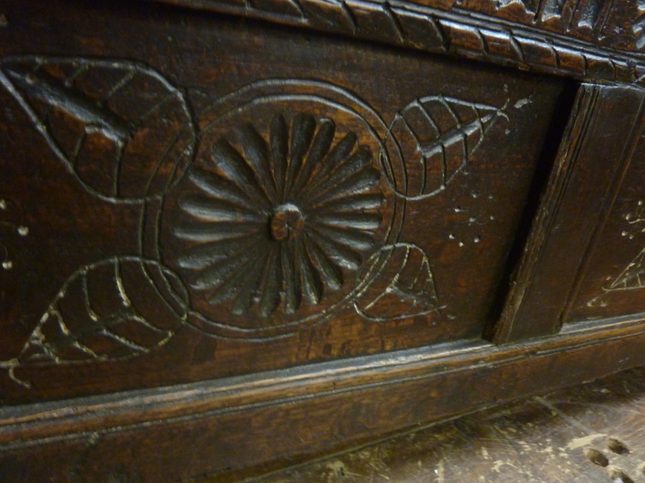 An 18th century oak coffer with hinged lid and panelled frame with moulded and carved detail, 110 cm - Image 3 of 3