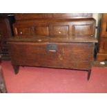 An antique oak six plank coffer with hinged lid and steel lock plate