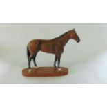 A Beswick matt glazed model of Nijinsky winner of the Triple Crown 1970, raised on an oval wooden