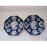 A pair of unusual 18th century plates of octagonal form, possibly Bow, with painted blue and white