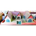 A substantial 20th century model farmyard in the form of a single U shaped building set within a