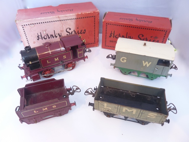 A collection of Hornby 0 gauge tin plate railway items to include a boxed LMS No 1 tank